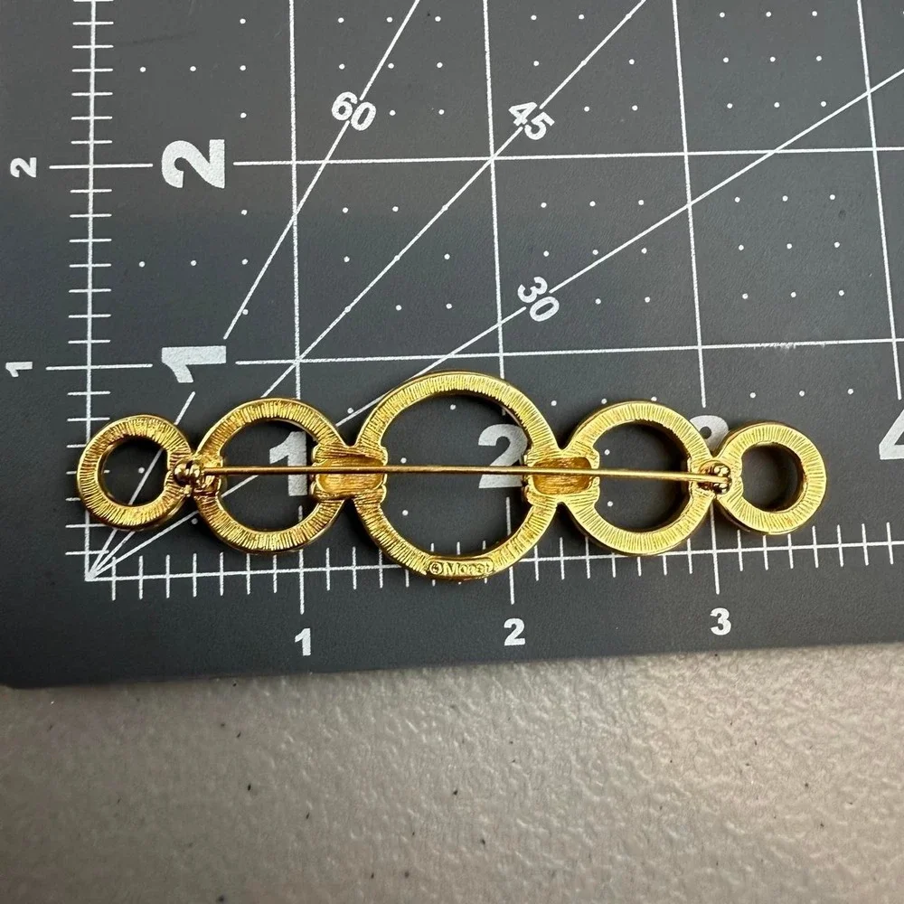 Monet Vintage Geometric Brooch Gold Tone Interlocking Circle Bar Design